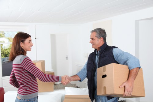 Loading boxes and household items into a moving van in Crystal Palace