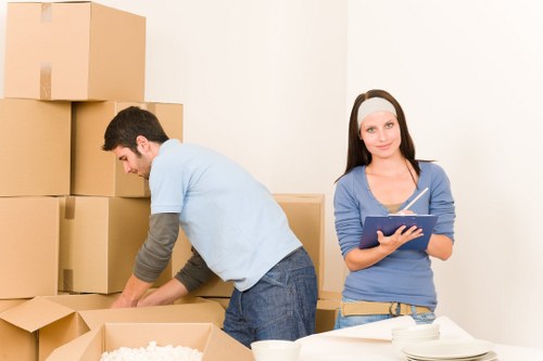 Removal team loading boxes and furniture for a local house move in Crystal Palace